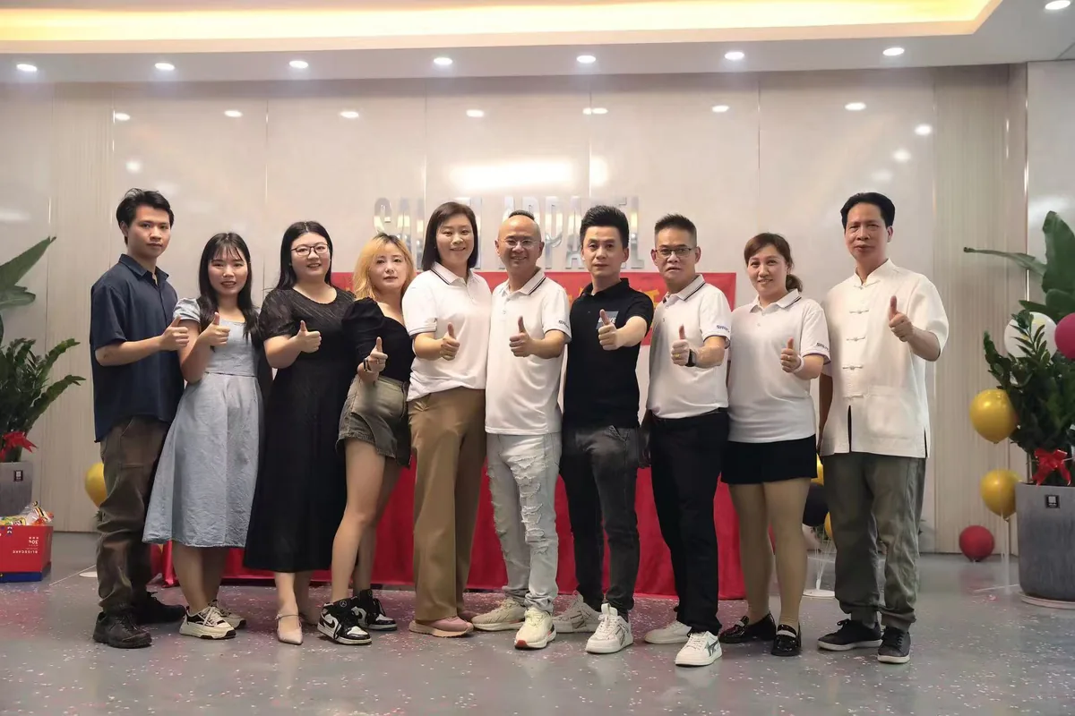 Visitors and the SALATI team posing together in the showroom