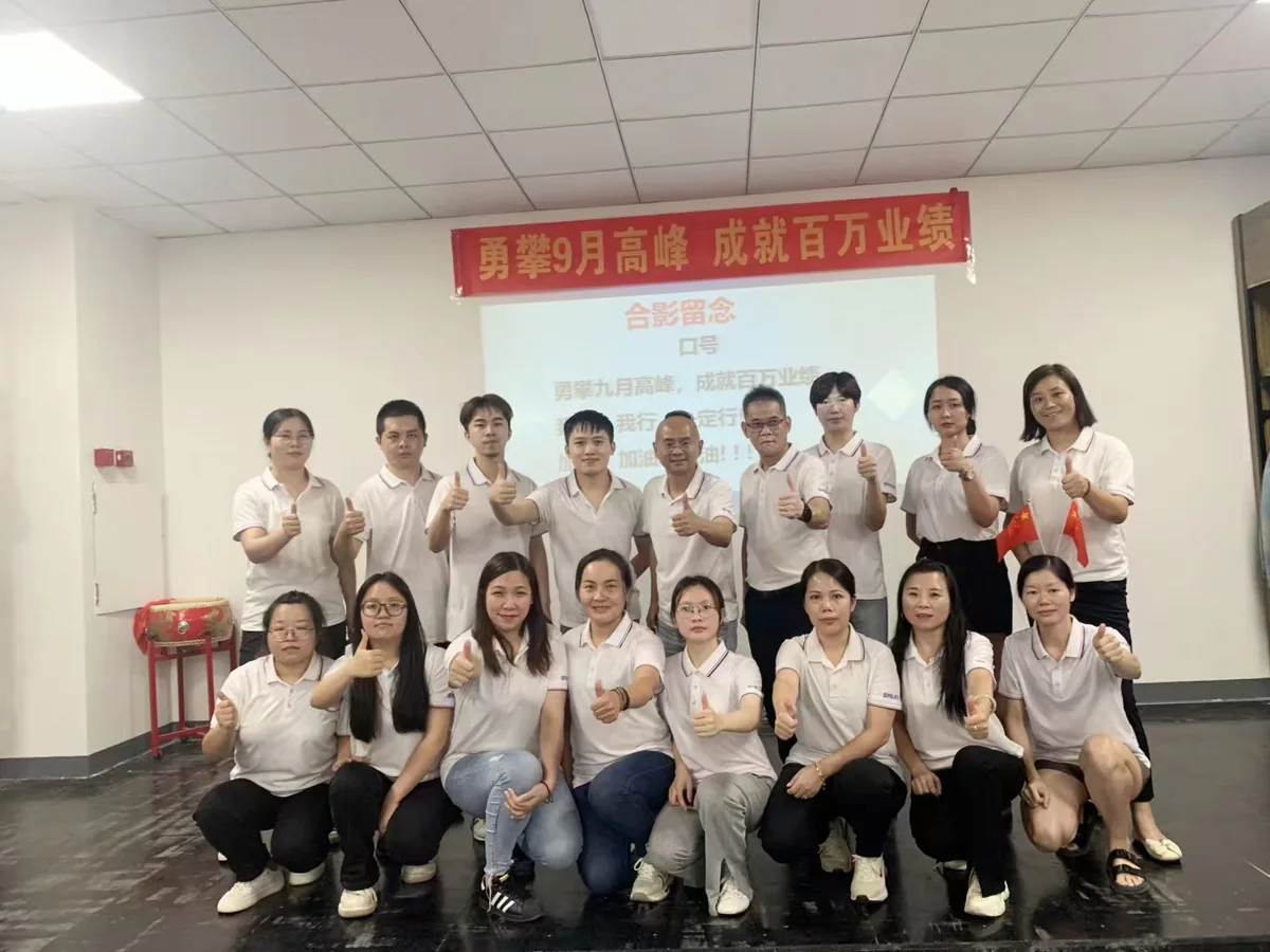 SALATI team group photograph at the company